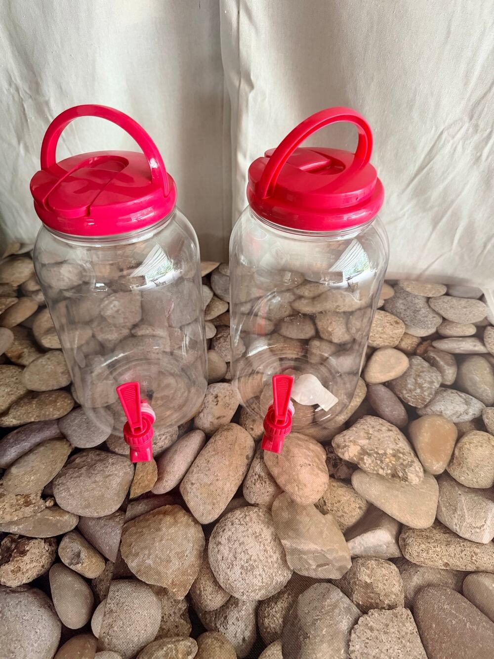 2 JUGS W/ PINK LIDS
